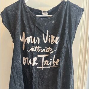 Black t shirt. Women’s. Your vibe attracts your tribe writing.